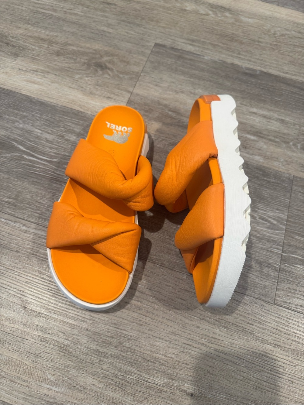 Sorel Women's Viibe Twist Slide in the bright Koi orange colorway